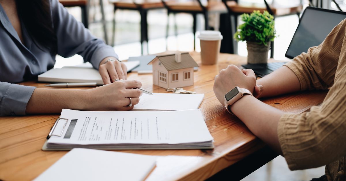 real estate agent reviewing contract with client