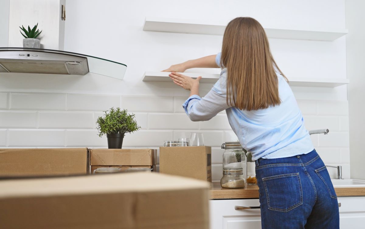 woman cleaning kitchen